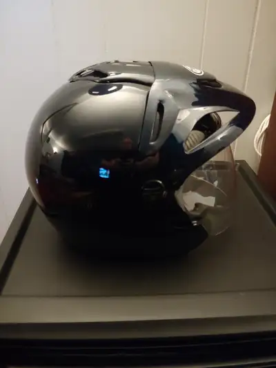 LIKE NEW HELMET WITH CARRY BAG,NOT A SCRATCH AND IS OPEN FACE WITH A RETRACTABLE VISOR THAT COVERS W...