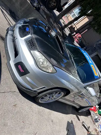 Selling my 2004 WRX with JDM V9 STI front end swap. Car has brand new OEM Hawkeye fenders painted O1...