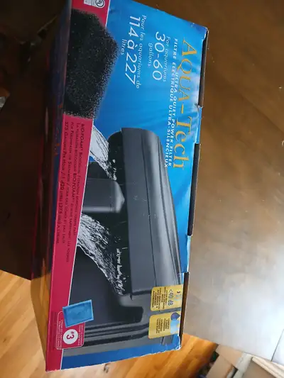 New in box 30g to 60g Aqua Tech filter. Does not fit on my tank. Never used.