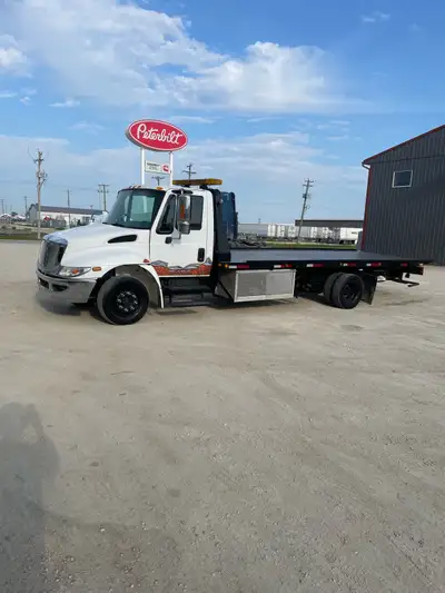 International 4300 Tilt Deck - comes with a new safety - good condition - read y to start working an...
