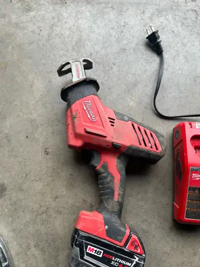 Milwaukee sawsall with battery and charger, View more
