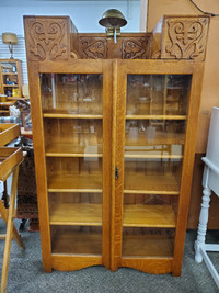 Early 1900's oak arts & crafts style two glass door cabinet
