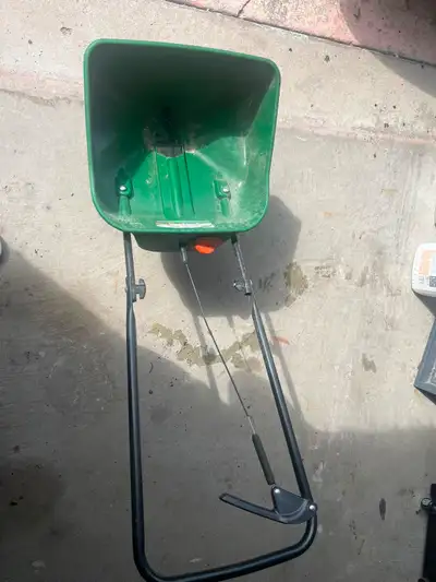 This looks like a Broadcast Spreader (also called a Lawn Seed & Fertilizer Spreader). You can use it...