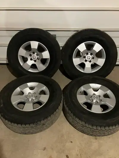 A set of factory Nissan Pathfinder rims. 6-114.3 or 6-4.5 inches. Tires are not great. Be good for w...