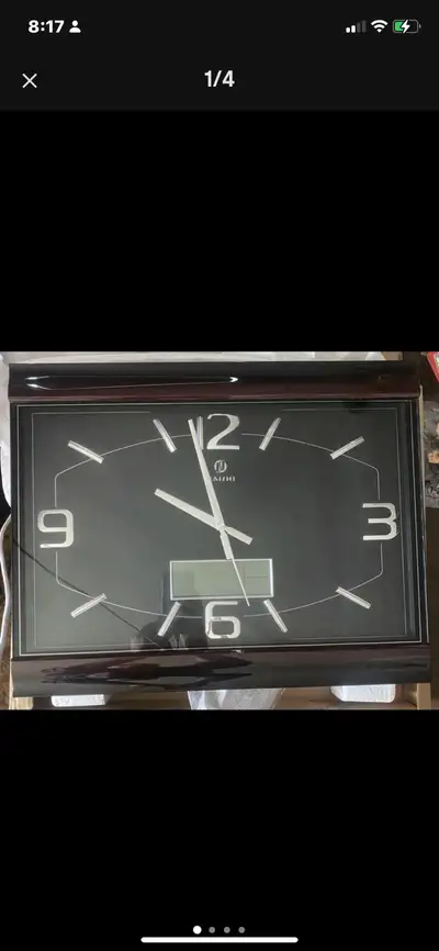 Add a touch of modern elegance to your space with this Naishi wall clock! This is a new clock that f...
