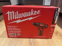 NEW Milwaukee 12V hammer drill with 2 batteries