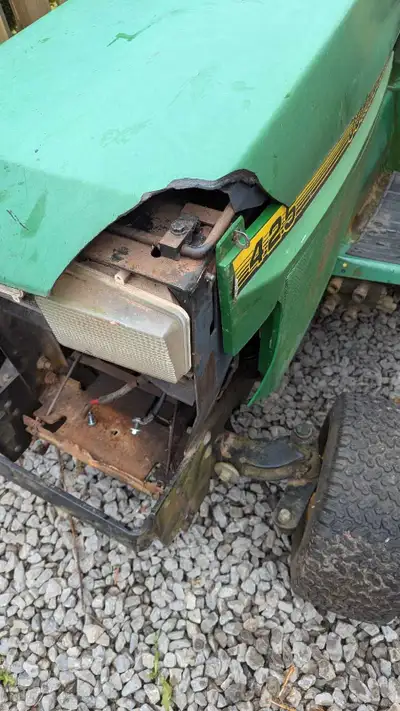 John Deere 425 AWS tractor with 54" deck, it runs and drives came in on trade selling as is, power s...