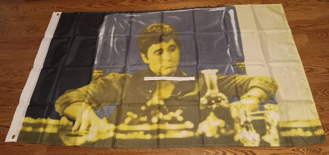 SCARFACE WITH YELLOW FACE SITTING FABRIC FLAG 35 X 60 3/4 INCHES in Other in Mississauga / Peel Region