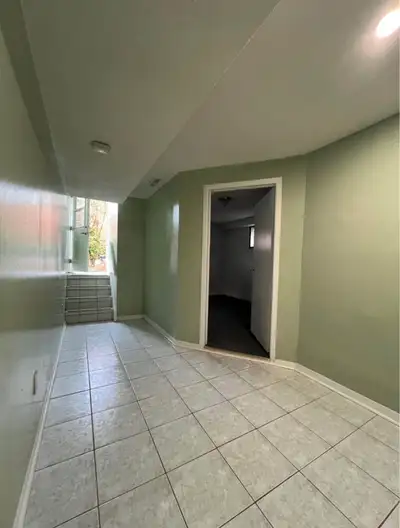 Bright 2-bedroom, 1-bath basement apartment with kitchen and private entrance.