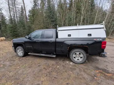 Selling my 2014 Chevy Silverado. Comes with bedslide and industrial canopy. Also comes with studded...