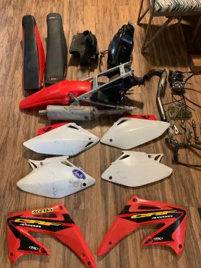 2005 crf450r parts plastics have some scratches and scuffs on them. subframe with rear plastic air b...