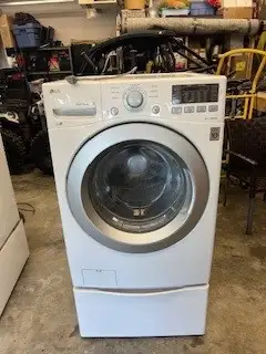 Used LG Washer & Dryer For Sale. Dryer is a Natural Gas dryer. 7 years old. Includes bases for both...
