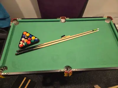 Kids pool table. No blemishes. One pool cue could be replaced