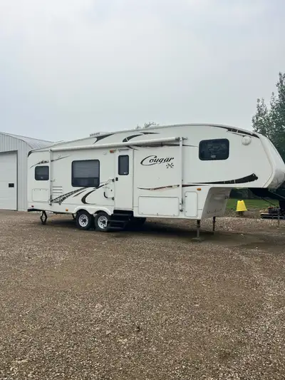2009 Cougar, excellent shape, great tires, new high end mattress, AC, everything works as it should!...