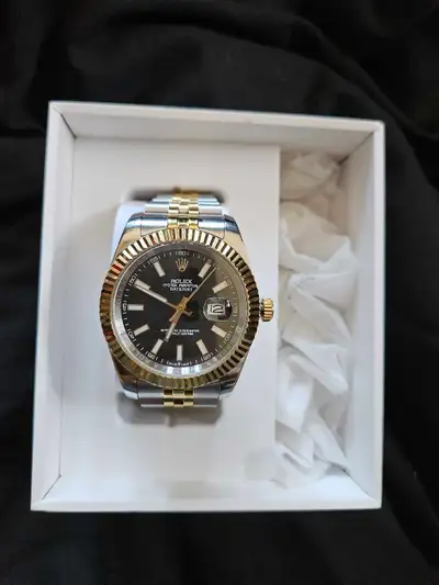 2004 ( Replica ) Oyster Perpetual Date Just. Feels and looks Great, other then the Stamp indicating...