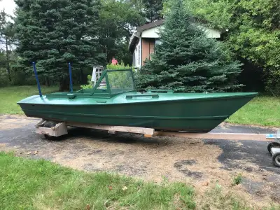 15 foot boat. Suits a ten horsepower outboard. Trailer included (not for highway).