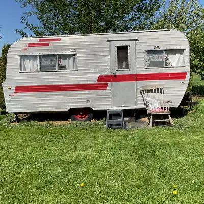 16’ retro trailer has fridge propane stove and toilet. Great for backyard kids play house or park it...