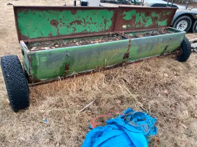 John Deere seed drill converted to a vegetable flower planter. Measures 11'10" long, 6'4" wide. It i...