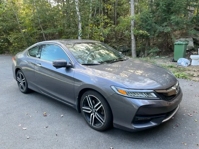 Honda Accord Coupe in like-new condition, including warranty.