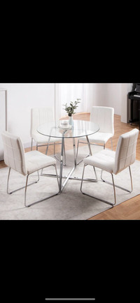 Brand new glass table with white chairs