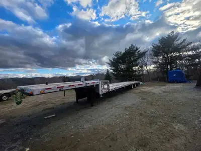 2016 low pro step by Wilson. It is a combo steel frame and aluminum deck. It is a three axle trailer...