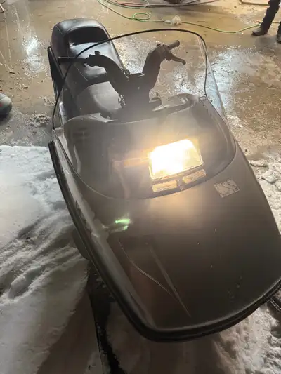 Great kids snowmobile with electric start and tow hitch for the kids also has hand warmers. Fan cool...