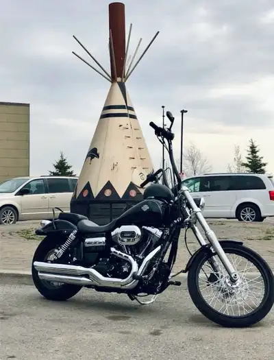 Classic Harley Wide Glide with true chopper stance-long rake, skinny front end, and that stretched-o...