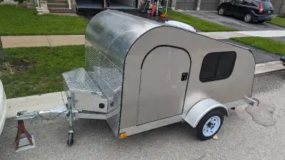 Custom built teardrop camper. Sleeps upto 3. Aluminum exterior on a galvanized trailer frame. Built...