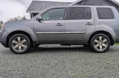 This Honda Pilot Touring is a great vehicle with high Km's and lots of life left. Inspected until Oc...