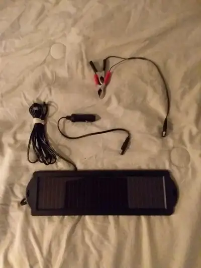 Smart trickle charger for your vehicle battery when it is parked. Purchased from Canadian Tire years...