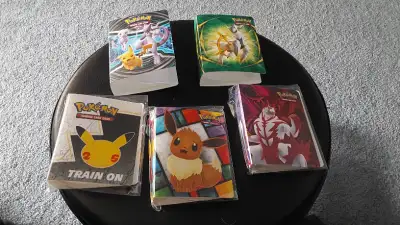 Small Pokemon binders, 25th Anniversary Pikachu and Urshifu left, View more