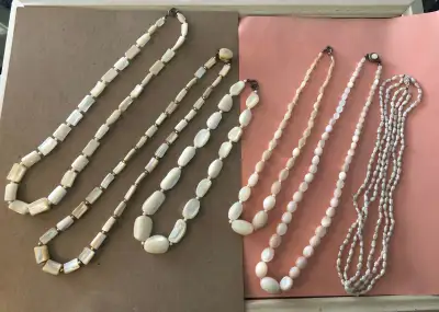 6 all white necklaces made from quartz , glass, shell and freshwater pearls (3 strand necklace)