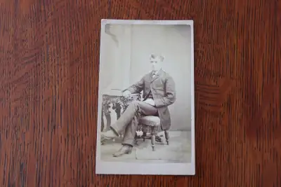 Hi. I have a vintage cabinet card photograph for sale. The photo is of a man sitting at an ornately...