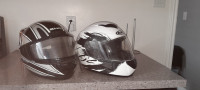 2 motorcycle helmets almost new, white one is large,black small