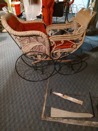 Beautiful vintage wicker baby pram.