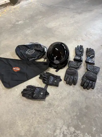 Never worn like new Harley Davidson helmet and storage cover. I’m throwing in 3 sets of leather ridi...