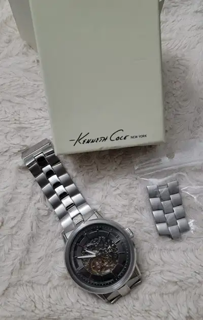 Selling this Kenneth Cole New York men’s skeleton automatic watch. Stainless steel band and case, se...