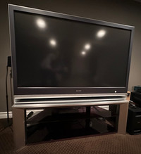 FREE ---  Sony 55" TV(is working) stand and universal remotes 