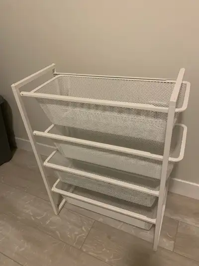 Organize your space with this handy white IKEA metal basket shelf! This unit has four sturdy baskets...