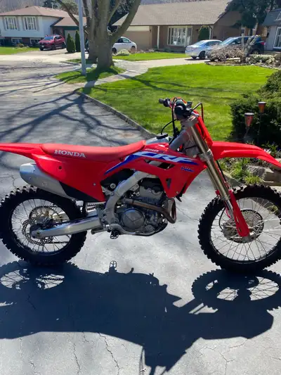 I have a 2022 Honda crf250R great condition fires right up with electric start comes with stand helm...