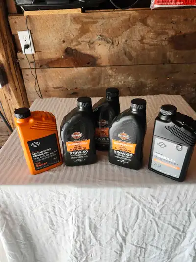 Four new bottles of Harley- Davidson 20/50 oil plus one new bottle Harley-Davidson Formula+ transmis...