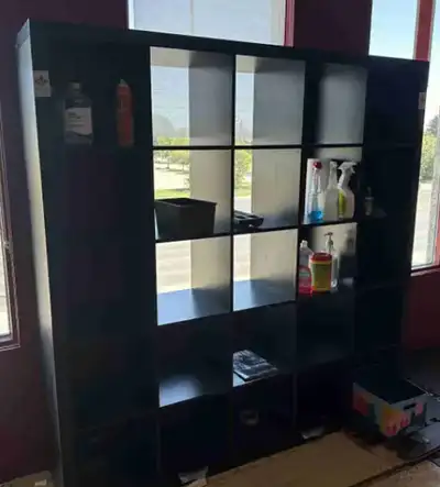 This is a used dark colored bookcase, perfect for organizing your books and displaying your favourit...