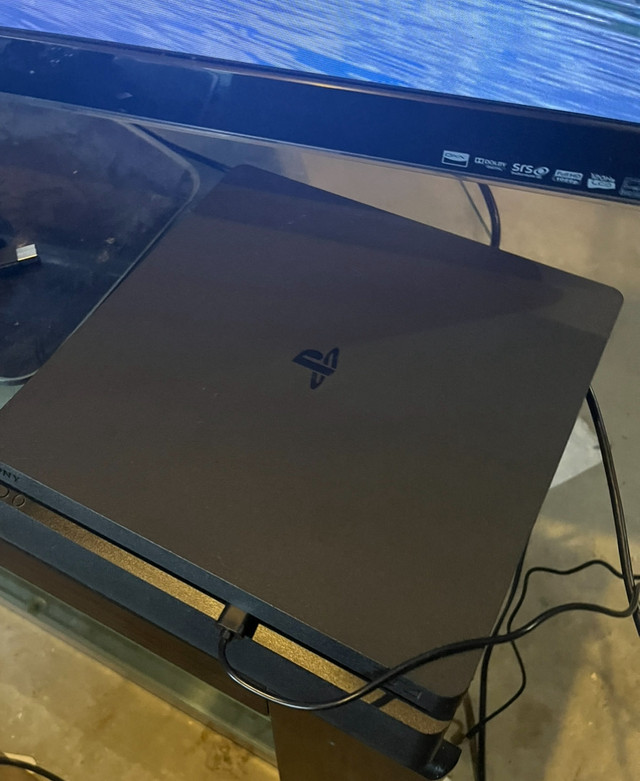 PS4 Slim 1Tb  4 controllers and lots of games in Sony Playstation 4 in Winnipeg