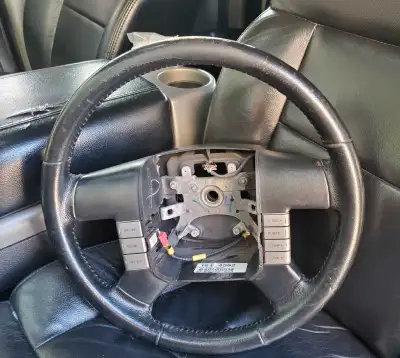 Selling black leather wrapped steering wheel from 04-08 f150. Does not come with airbag. Has very mi...