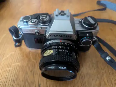 Olympus OM-10 35mm SLR, excellent condition, minimal use. Includes timer, extra lens, flash,instruct...