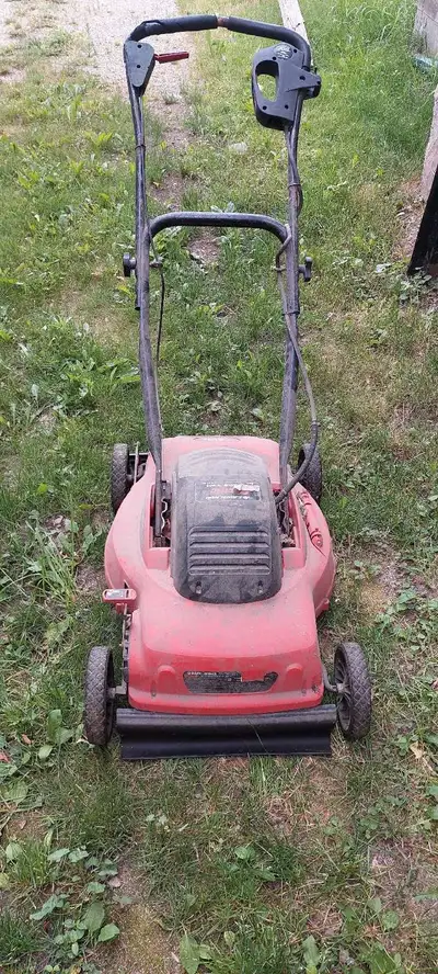 18" Corded lawn mower. Handle flips, which actually really helps avoiding the extension cord. Stores...