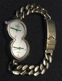 Double face wristwatch by Andrew Fezza