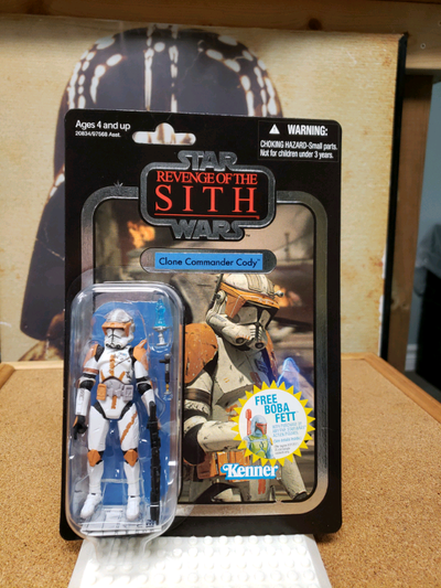 2010. New and sealed. Foil variant. Boba Fett promo sticker. A couple of fine scratches near peg hol...