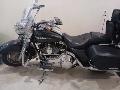 Selling my 2005 Harley-Davidson Road King, a black pearl beauty ready for the open road, featuring a...