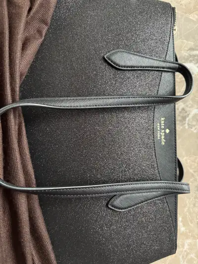 Large Kate Spade tote, in excellent shape. Zipper closure with a subtle but eye catching sparkle.